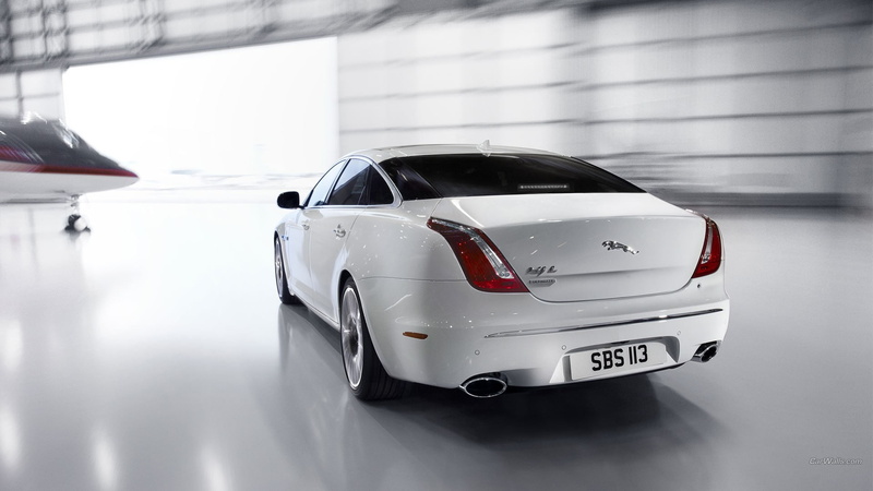 no people, vehicle, indoors, land vehicle, hangar, mode of transportation, transportation, white color, architecture, white cars, road, car, reflection