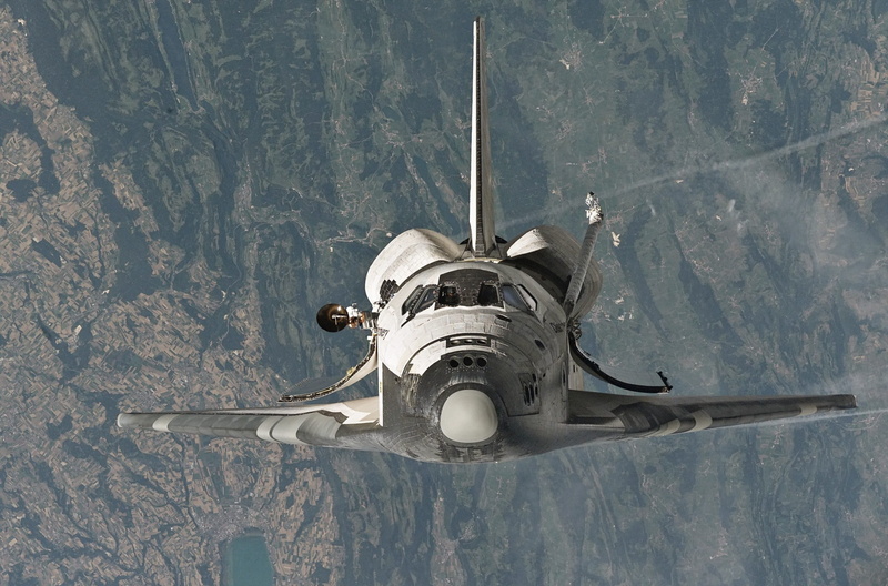 rocket, single object, no people, photo, discovery, flying, fighter plane, outdoors, motion, nature, mission, directly above, astronaut, spaceship, air vehicle