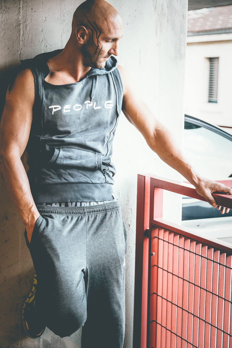 built structure, young, leisure activity, architecture, style, tattoos, pose, fashion, urban, photoshoot, sleeveless, indoors, face, three quarter length