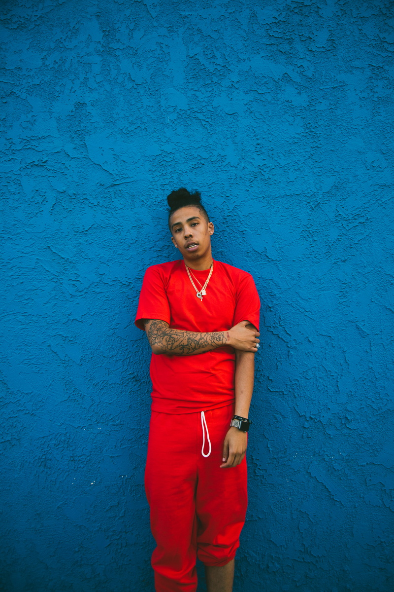 standing, blue, portrait, wall art, t, real people, african american, sweatpants, front view, contemplation, young men, wall - building feature, man, wearing