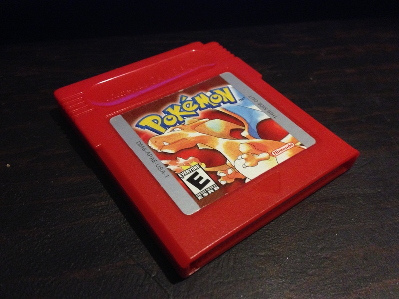 indoors, gameboy color, food, pokemon go, photo, game, box - container, high angle view, wood - material, text, nintendo, toy, video game, closeup, pokemon red