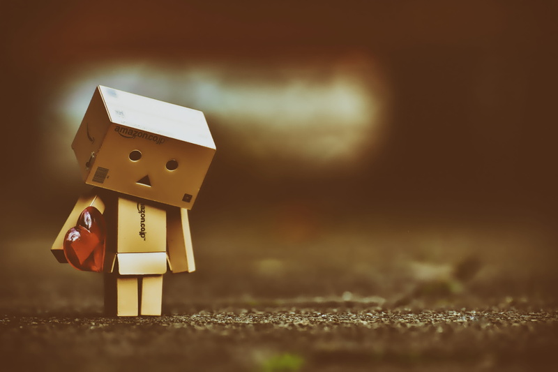 selective focus, single object, art and craft, box, heart, heart pain, nature, indoors, robot, cardboard, wood - material, figurine, 5K, longing, focus on foreground