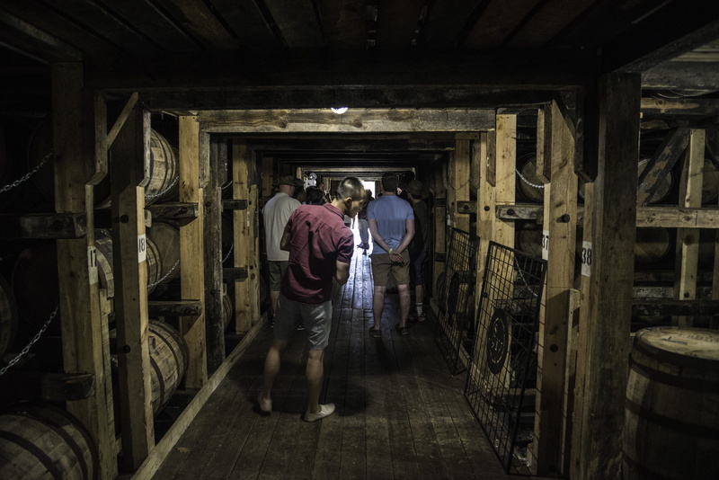 warehouse, dark, building, built structure, adult, rear view, casual clothing, walking, indoors, storage, males, Cellar, people, Makers Mark, factory, Tourists