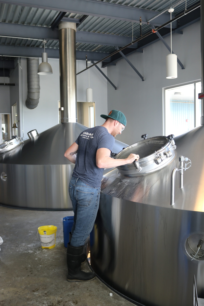 kitchen, machine, occupation, looking, business, industry, worker, full length, production, food and drink, factory, adult, person, stainless, container
