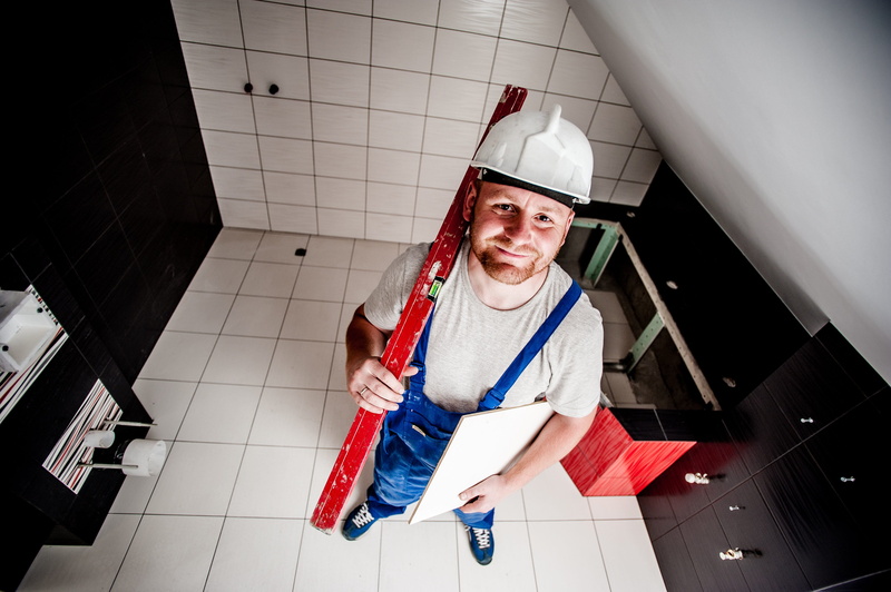 the operator, home, looking at camera, humor, indoors, worker, people, men, helmet, man, spirit level, blue, factory, work, young adult, professional, human blood