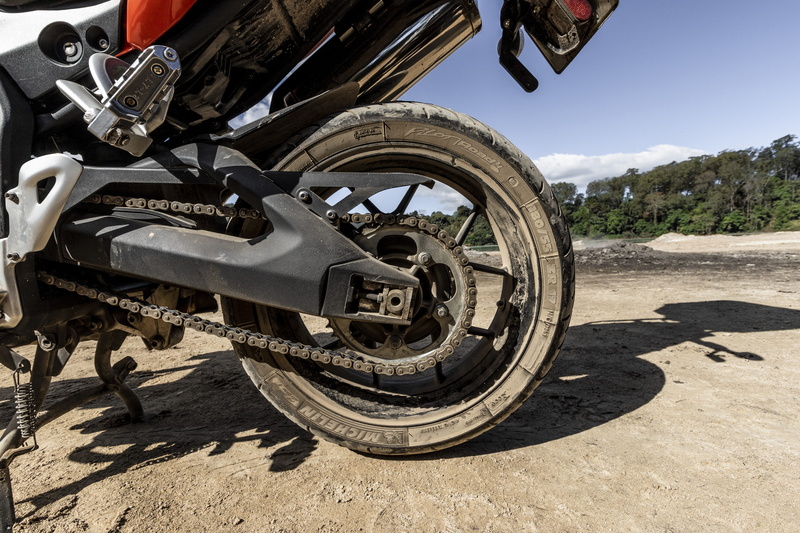 car wheel, coil, alloy wheel, motor, wheel, mode of transportation, day, land vehicle, nature, mountain, spiral, machine, spoke, suspension, axle, transportation