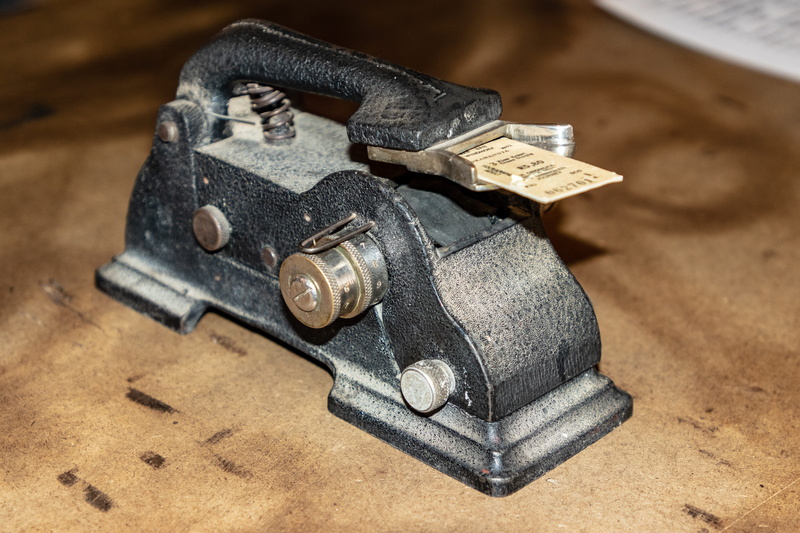 bankruptcy, projector, hardwood, safety, wood, finance, vise, no people, accessories, gun, indoors, metal, tool, studio shot, recession, still life, weapon