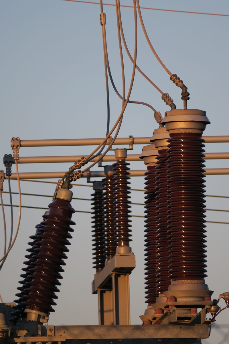 danger of death, lighting equipment, current, large group of objects, outdoors, electricity, spiral, connection, low angle view, metal, caution, energy