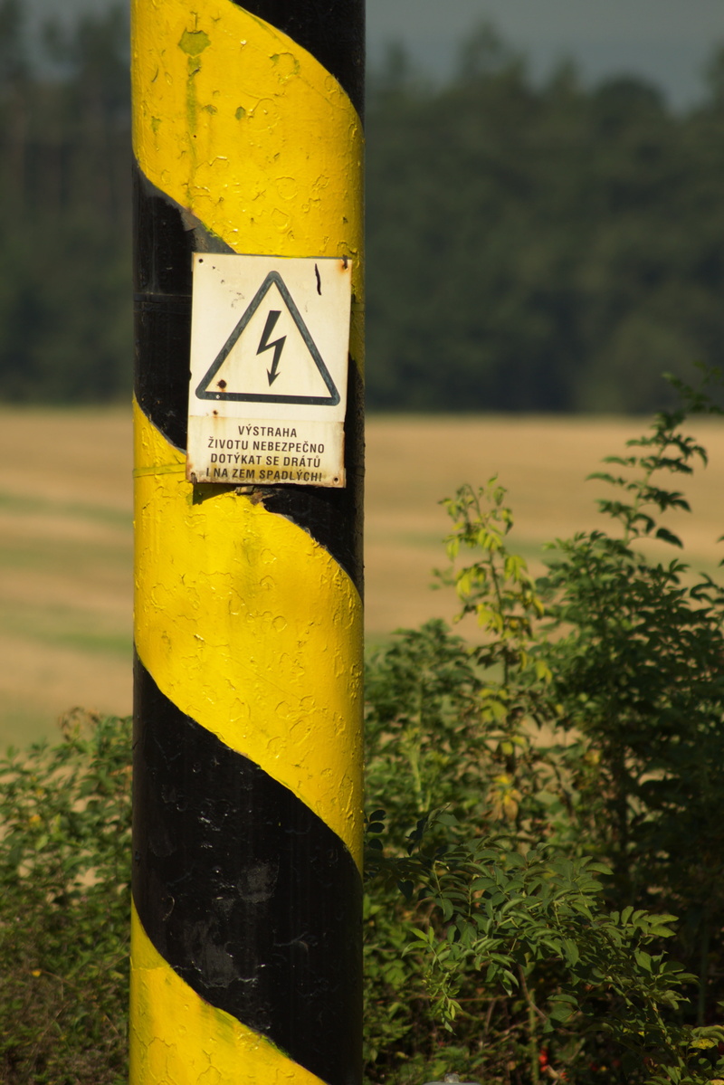 warning, power lines, power line, flash, note, close-up, road, day, text, no people, traction current, close, voltage, risk, high voltage, guidance, western script