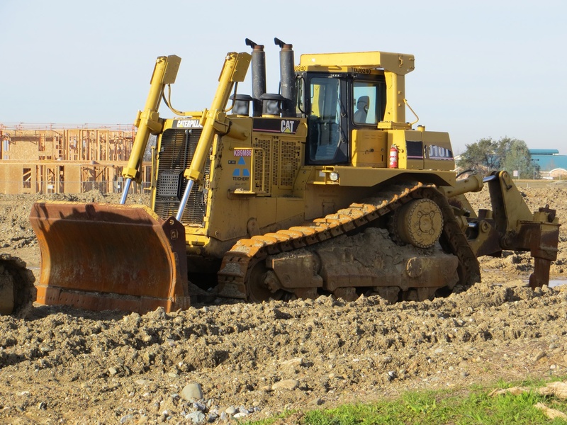machinery, development, vehicle, bulldozer, tractor, construction machinery, road, tree, sunlight, digger, transportation, quarry, construction site, land