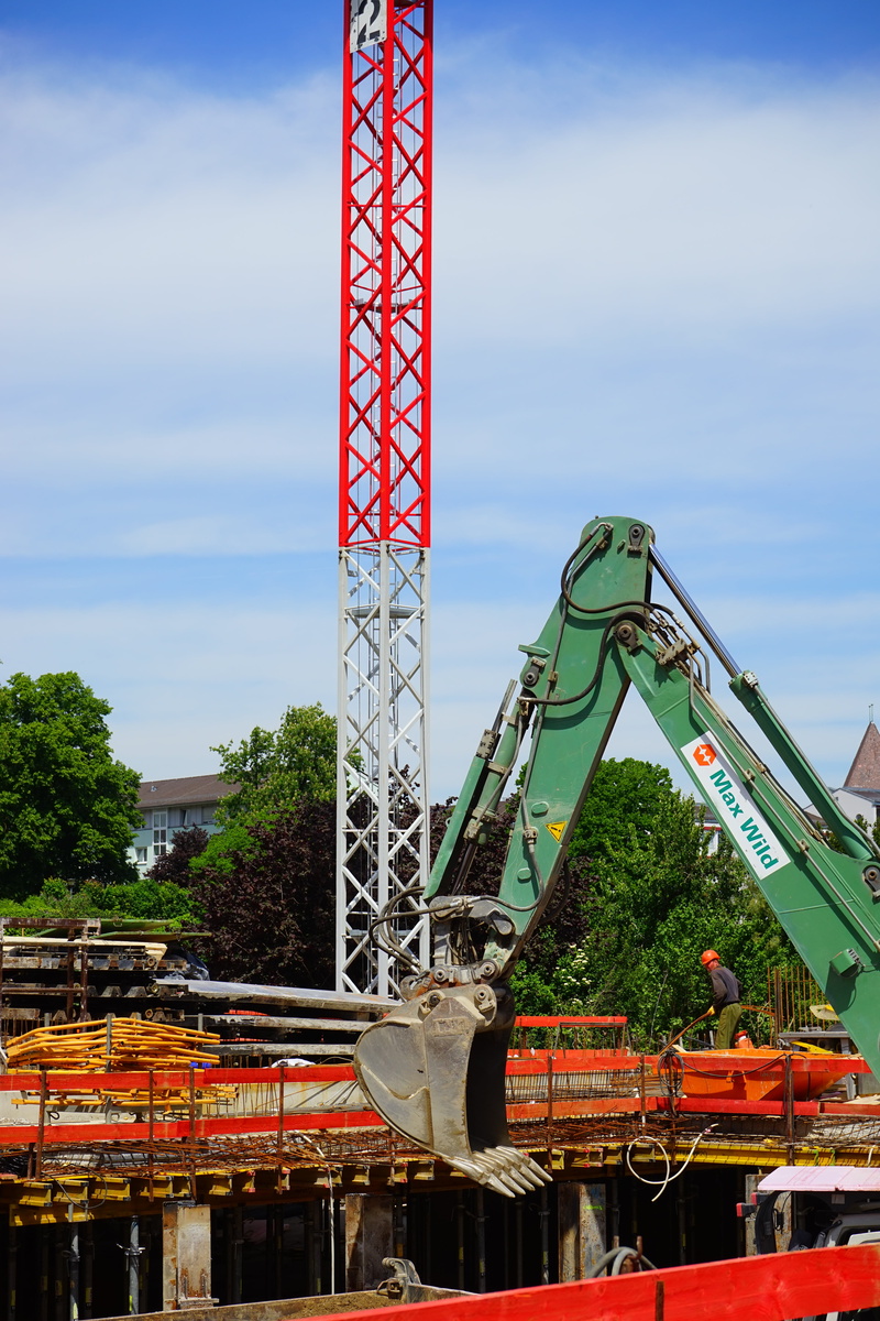 arts culture and entertainment, outdoors, construction workers, construction Site, red, industry, nature, crane, day, amusement park ride, building exterior