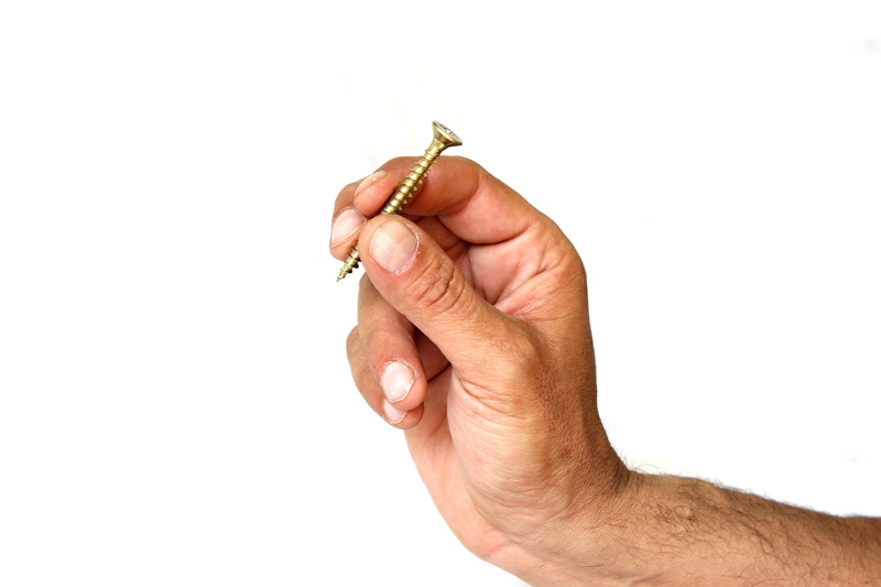 nuts, tools, mechanic, indoors, person, human body part, food, industrial, one person, object, screw, glossy, stainless steel, head, still, human limb