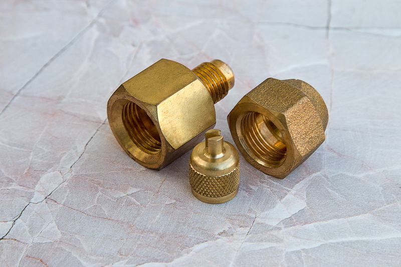 two objects, indoors, 5K, brass, bolt, economy, industrial, gold, wealth, coupler, hardware, stack, valve, luxury, piping, shape, high angle view, connection
