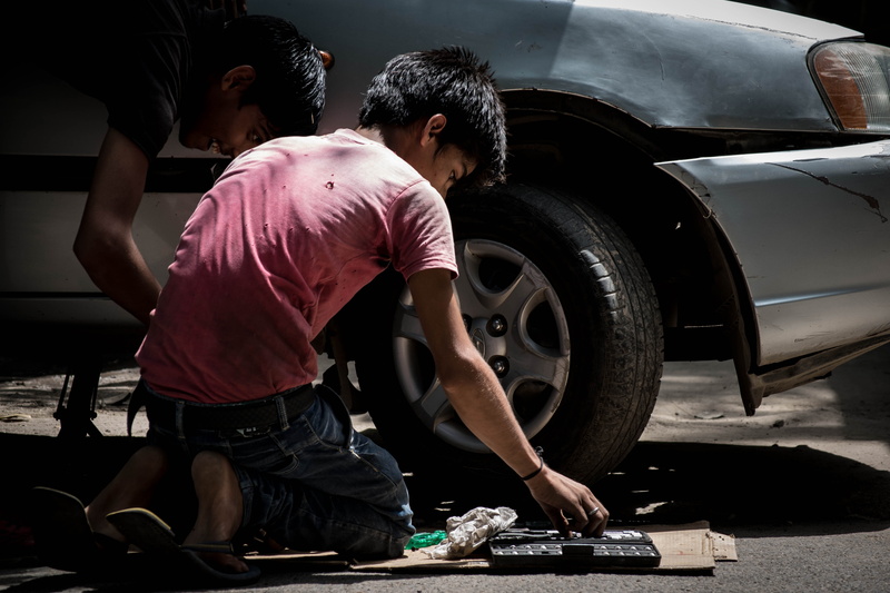 land Vehicle, repairing, tire, wheel, silver, Car Mechanic, labor, people, adult, mechanic, motor vehicle, day, transportation, auto Repair Shop, real people