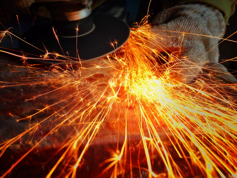 heat - temperature, disc, industry, moment, nature, stimulus, sparks, motion, long exposure, person, human body part, night, blurred motion, one person