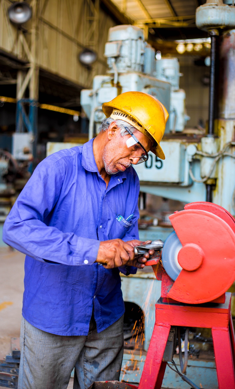 5K, industrial, machine part, people, machinery, human, yellow, tool, indoors, factory worker, hat, industry, hone, working, one person, man, metal work