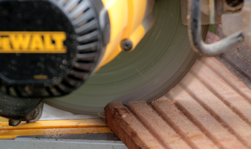 wooden board, no people, machinery, motion, outdoors, mode of transportation, splitter, carpenter work, cut of wood, crosscut saw, plug the saw, land vehicle