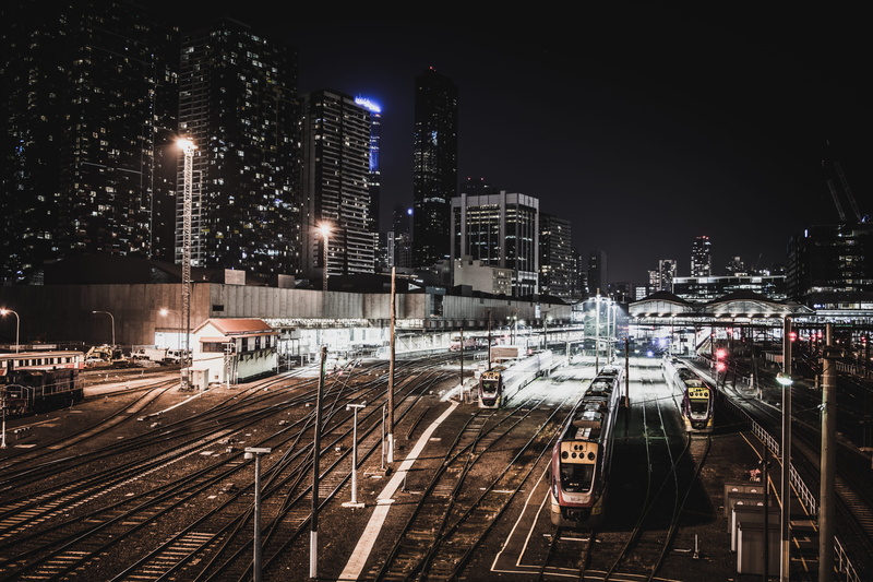 high angle view, trains, building, cityscape, building exterior, mode of transportation, night, railroad track, skyscrapers, railroad station, public transportation