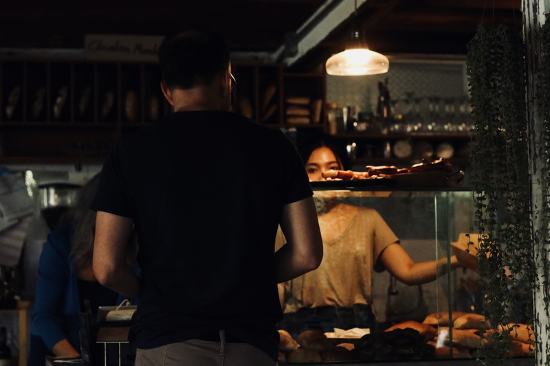 one person, flora, real people, night tiem, plant, person, seller, business, people, lighting, rear view, cafe, wearing, occupation, working, black, jar