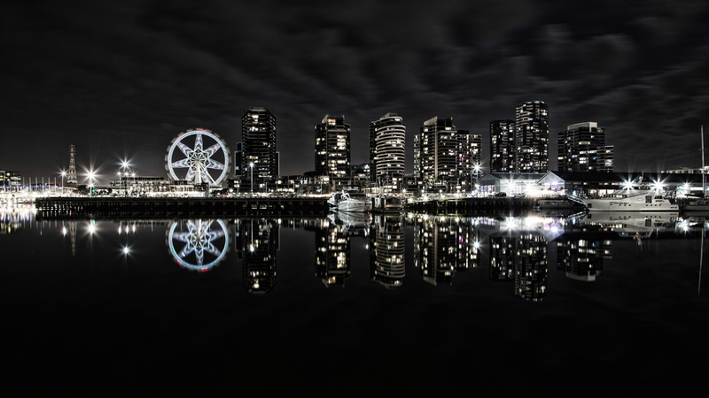 water, built structure, building, machine, town, reflection, skyscraper, wheel, spoke, downtown, car wheel, city, night, high rise, outdoors, docklands