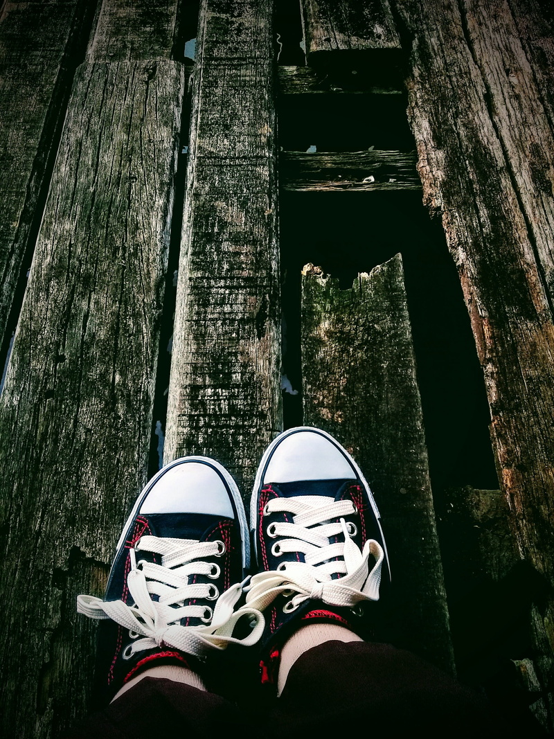 real people, one person, day, canvas shoe, low section, 2K, architecture, leg, girl, outdoors, body part, wood - material, standing, lockscreen