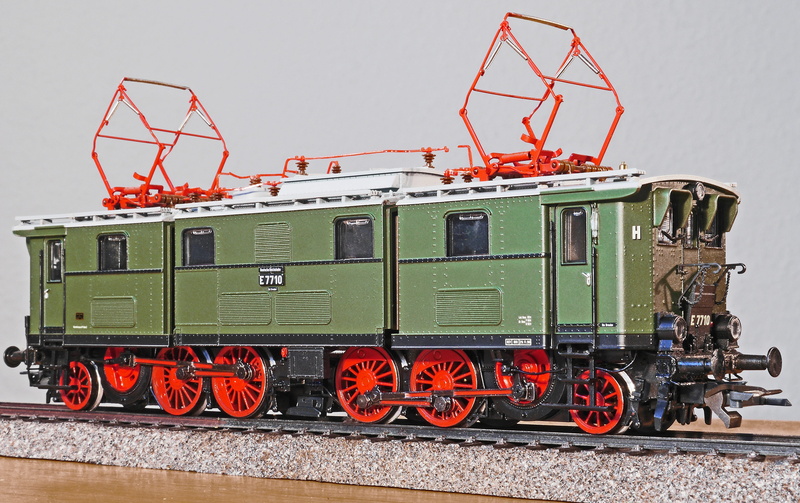 outdoors, light freight diesel locomotive, german reichsbahn, blind waves, orange color, gray, in three parts, 4K, old elektrolok, bridge frame, dresden old town