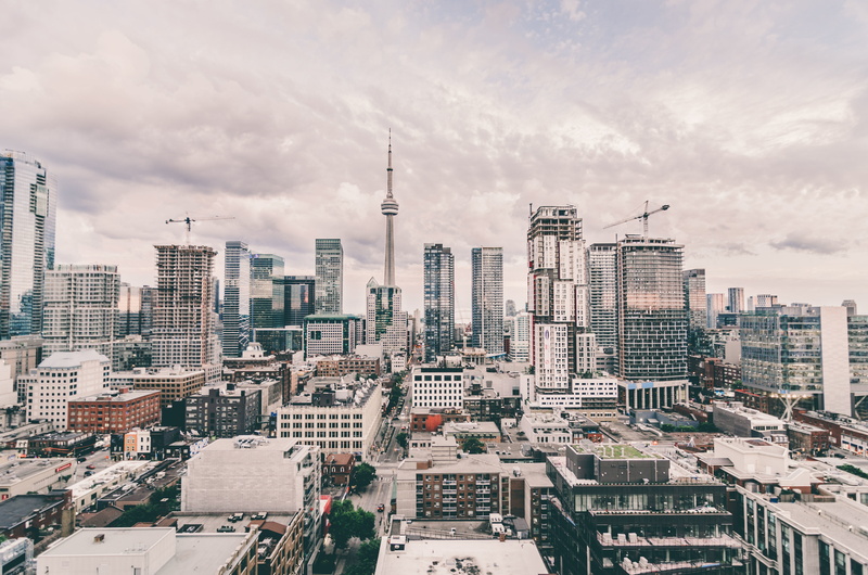 the horizon line, building exterior, roof, CN Tower, architecture, tall - high, clouds, Canada, gray, Toronto, city, modern, in the city center, cityscape