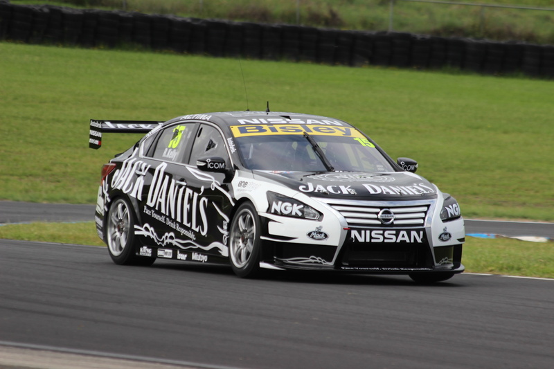 no people, plant, bathurst 12 hour endurance, stationary, toy, outdoors, motor vehicle, transportation, focus on foreground, text, car, 2K, green color