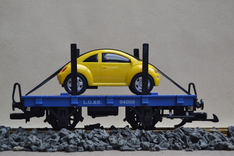 mode of transportation, tire, truck, number, solid, yellow, outdoors, autotransporter, garden railway, lgb, railway, wheel, industry, machinery, connection