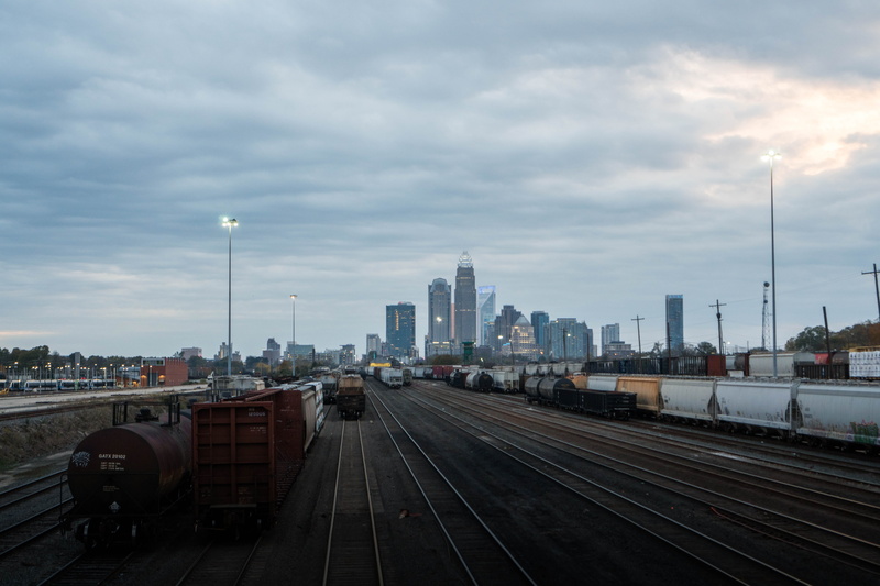 trainyard, building exterior, charlotte, track, no people, public transportation, 5K, sky, office building exterior, land vehicle, lines, shunting yard