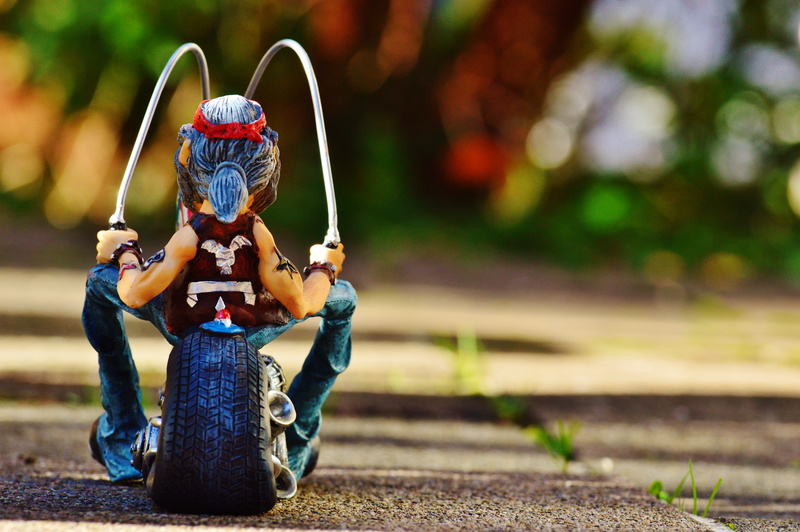 sitting, adult, full length, jeans, women, miniature, weapon, dom, focus on foreground, cool, holding, two wheeled vehicle, joy of life, farewell, tattooed