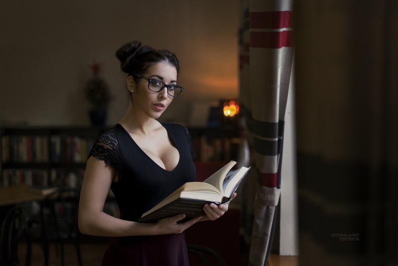 book, illuminated, activity, focus on foreground, reading, Barbora Zavadilová, hairbun, lifestyles, young adult, glasses, waist up, portrait, front view