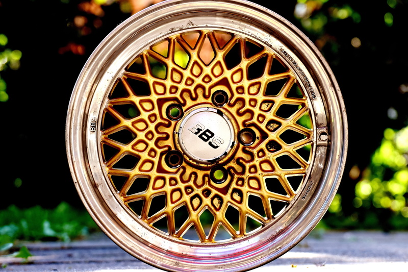 direction, wood - material, alloy wheels, w116, old, shape, western script, plant, travel, bbs, container, text, mercedes, wheel, focus on foreground, close-up