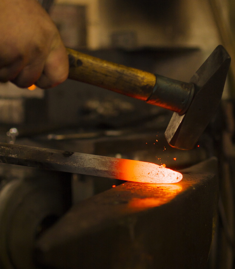 indoors, glowing, hand, fire - natural phenomenon, craft, forge, flame, blacksmith, fire, photo, finger, work tool, anvil, heat - temperature, occupation