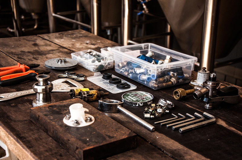 indoors, assorted, silver colored, large group of objects, industry, hand tool, equipment, occupation, work tool, workshop, thread, table, machinery, wood - material