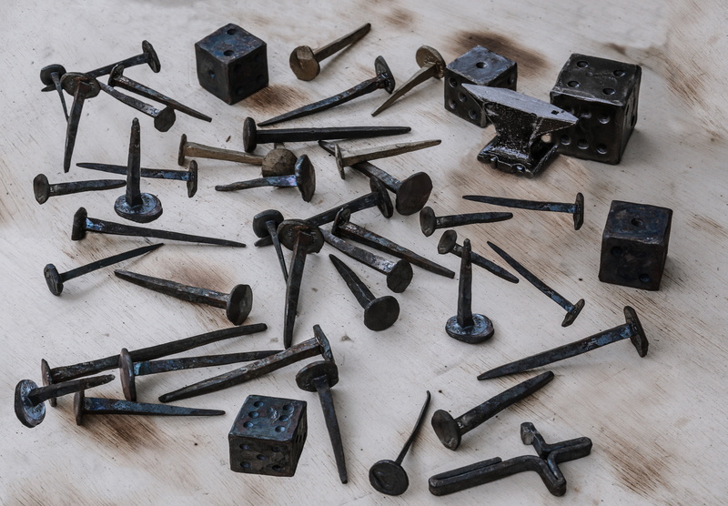 indoors, still life, high angle view, table, old, cube, nail, work Tool, antique, arrangement, hammer, collection, gun, order, hand tool, workshop, wood - Material