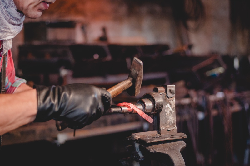 business, very personal, metal, indoors, gray, finger ring, holding, traditionally, art and craft, handmade, metal work, romantic, skill, occupation, metal industry