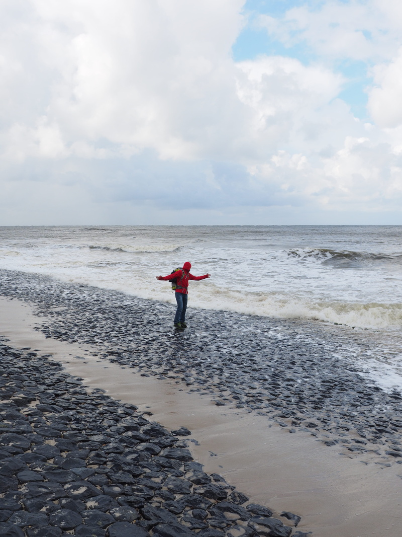 man, non-urban scene, human arm, 4K, rear view, human, standing, real people, sandbar, one person, sand beach, forward, cloud - sky, north sea, sky, lifestyles