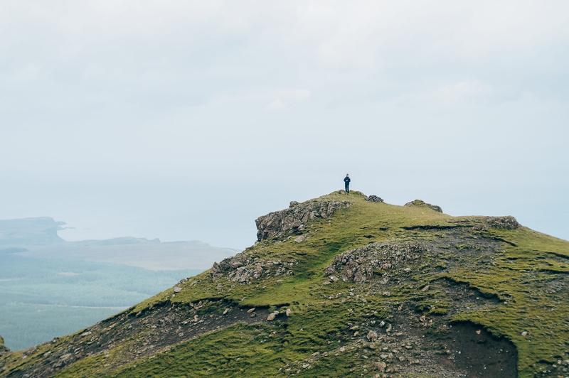 formation, leisure activity, grassland, tranquil scene, nature, mountain, beauty in nature, highland, storr, scenics - nature, person, sky, lifestyles