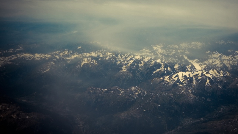 non-urban scene, aerial view, mountains, snow, tranquility, tree, plant, mist, landscape, day, birds, low angle view, tranquil scene, sky, beauty in nature