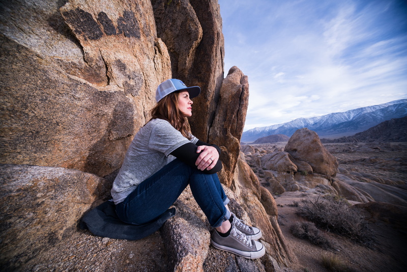 leisure activity, young adult, day, happy, beautiful, rock, rock - object, long hair, outdoors, full length, real people, snow, activity, hat, alabama hills