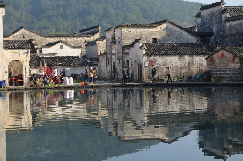 building exterior, hongcun village, building, place of worship, outdoors, lake, architecture, water, residential district, anhui, houses, large group of people