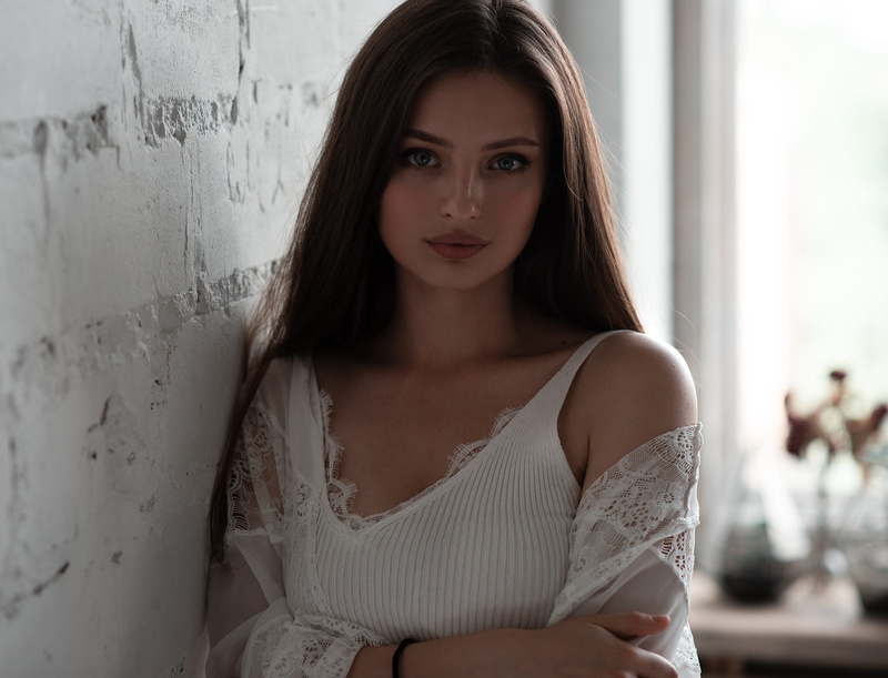 white wall, portrait, women, 1080P, straight hair, blue eyes, brunette, Andrew Phirsov, white tops, face, Veronika Avdeeva, long hair