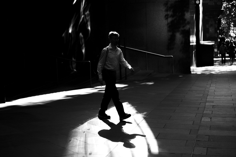 photography, men, gray, sidewalk, walking, near, pavement, motion, sunlight, footpath, full length, person, business, shadow, city, greyscale, male, city life