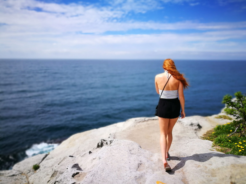 horizon, scenics - nature, shorts, girl, nature, solid, side, slippers, recreation, black, real people, cliff, skirt, rock, rear view, beauty in nature