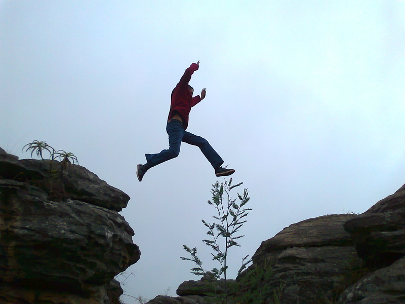 lifestyles, success, action, men, rock formation, mountain, jump, effort, man, rock - object, extreme Sports, human arm, sport, risk, chasm, cliff, leisure activity