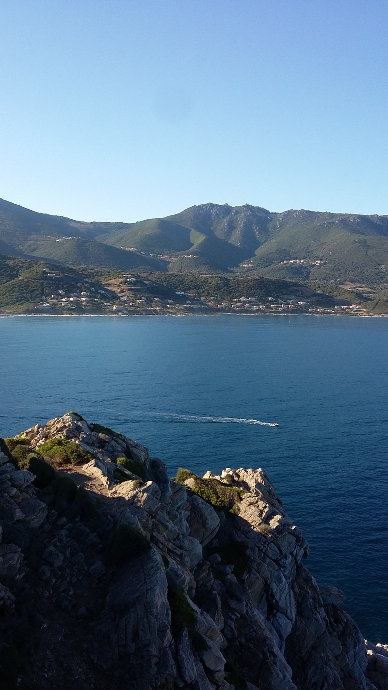 mountain range, europe, beauty in nature, water, copy space, rock, outdoors, landscape, rocky coastline, no people, holiday, rock - object, boat, clear sky