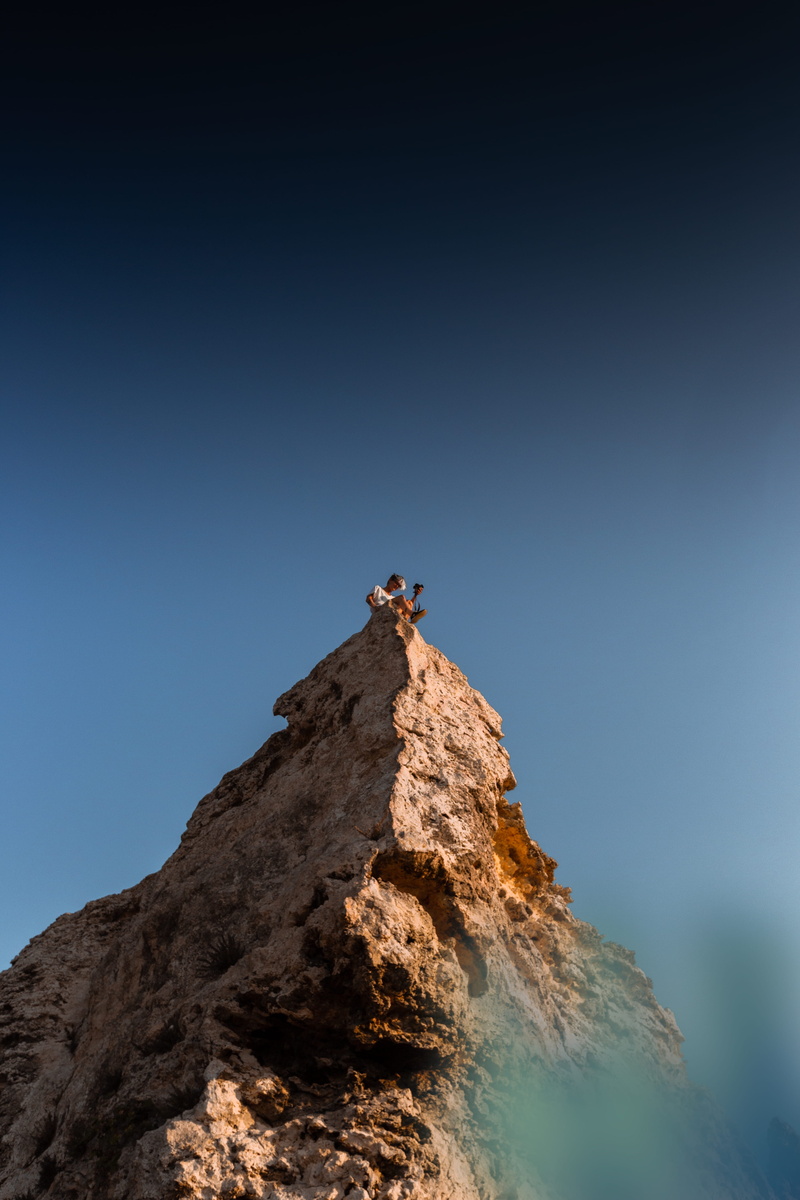 formation, island life, mountain peak, real people, man, moody tones, rock - object, scenics - nature, mountain esk, beauty in nature, clear sky, wandering