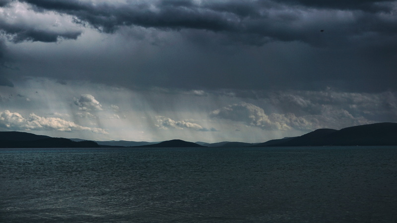 landscape, mountain, tranquility, storm, lake, outdoors, waterfront, sky, mountains, moody, ominous, no people, water, non-urban scene, clouds, storm cloud