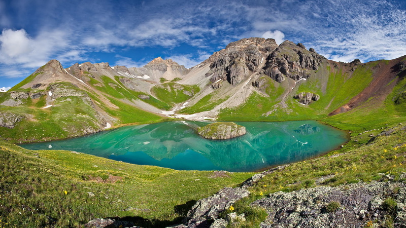 cloud - sky, non-urban scene, landscape, mountain range, water, volcano, beauty in nature, tranquil scene, green color, travel destinations, tranquility